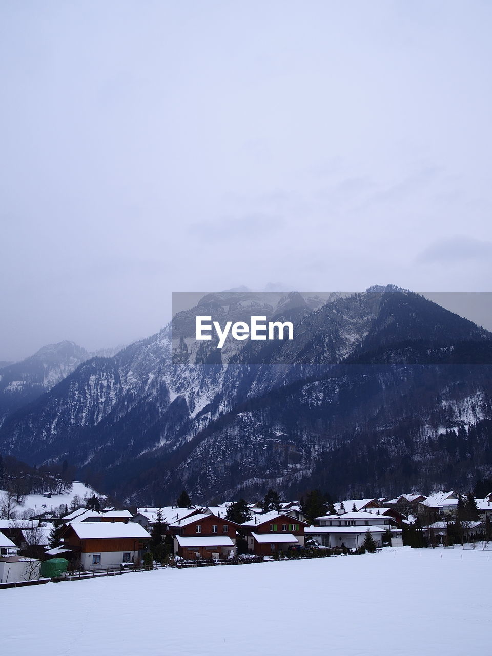 Scenic view of snowcapped mountains against sky during winter