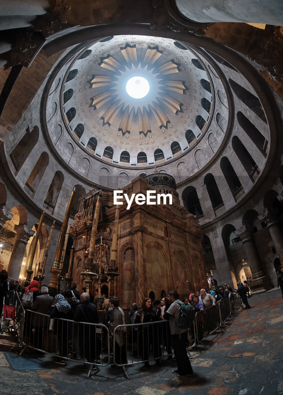 GROUP OF PEOPLE OUTSIDE TEMPLE