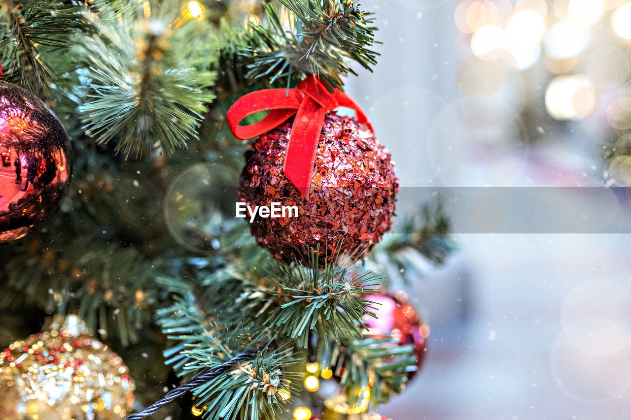 Christmas background of a christmas tree decorated with christmas toys.winter holidays. new year