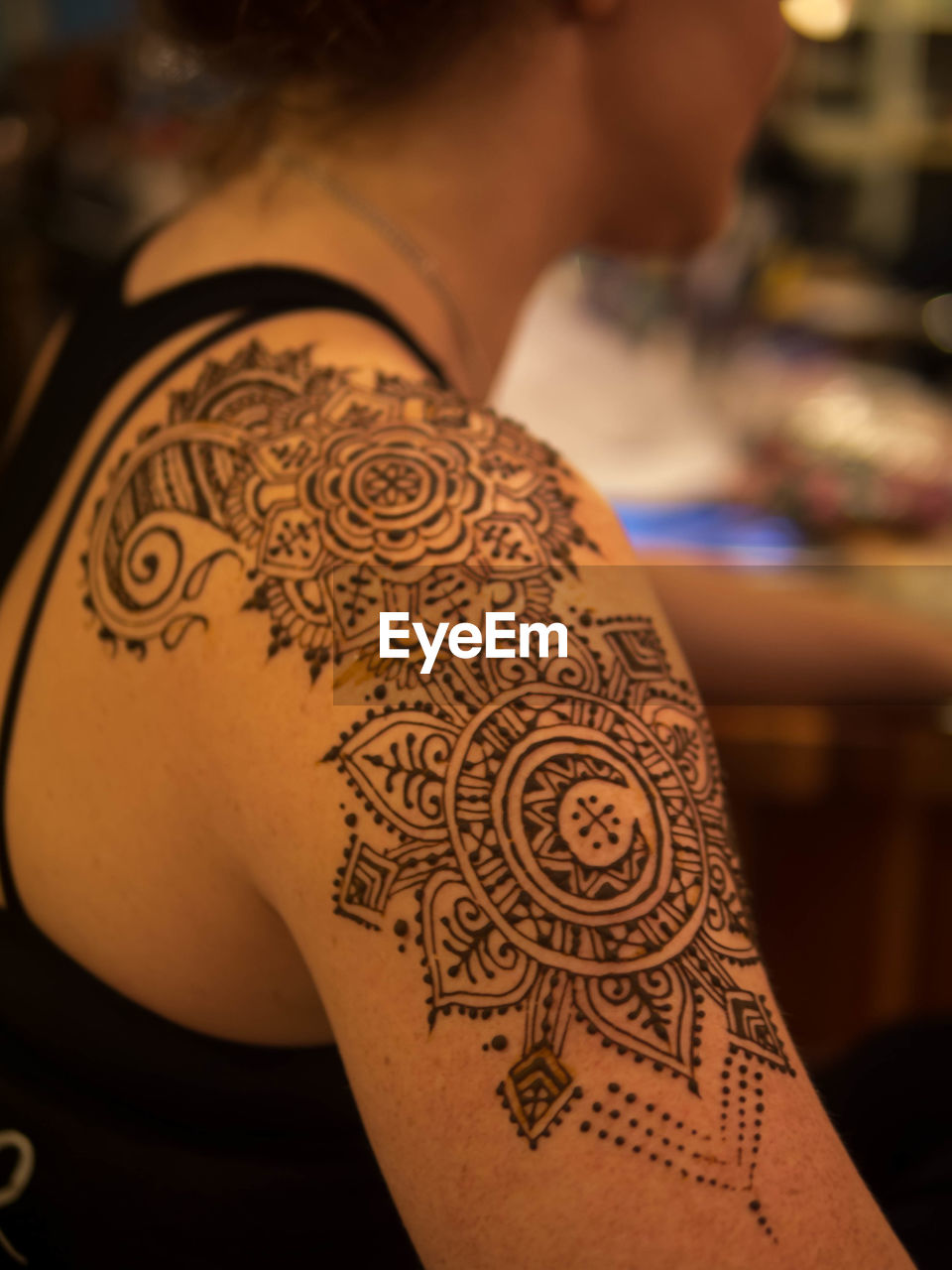 Close-up of henna tattoo on woman hand