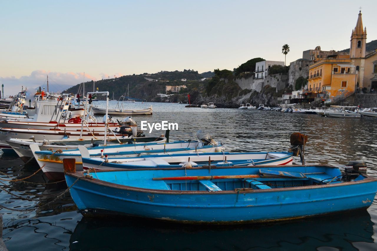 Boats moored at harbor