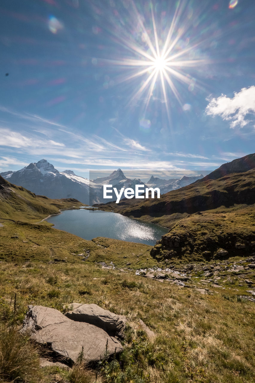 View of calm lake against mountain range