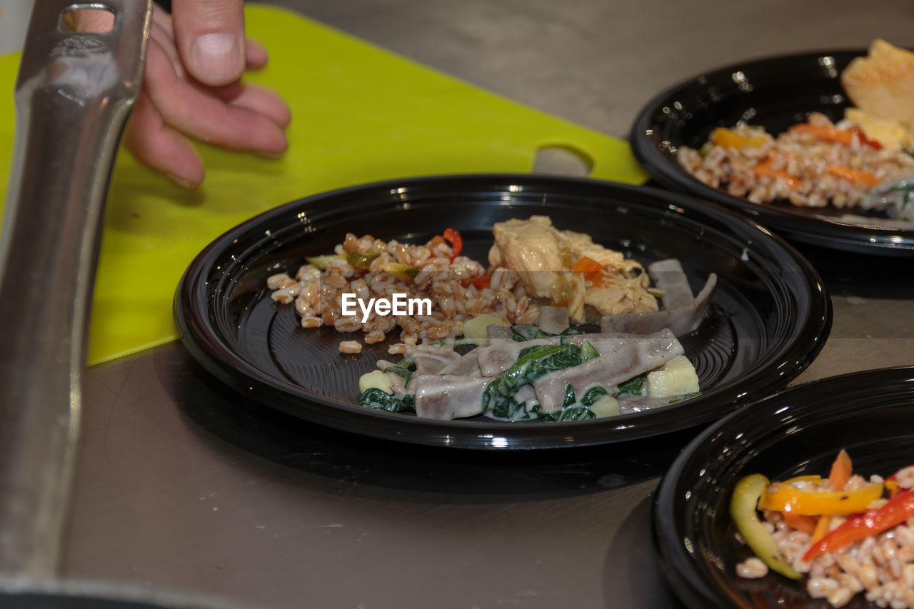 HIGH ANGLE VIEW OF FOOD IN CONTAINER