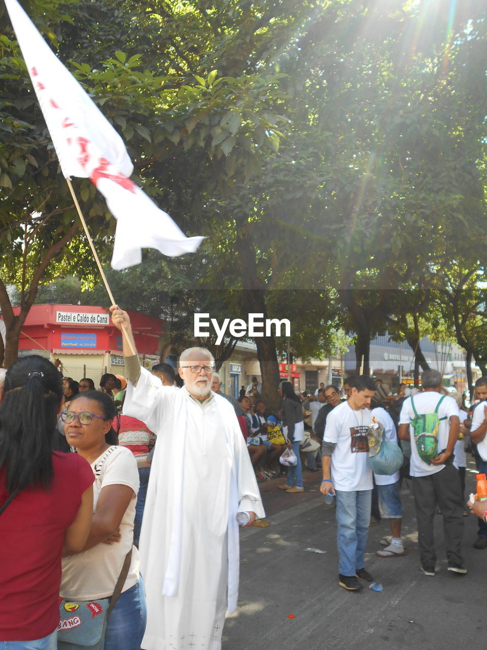 PEOPLE STANDING BY STREET