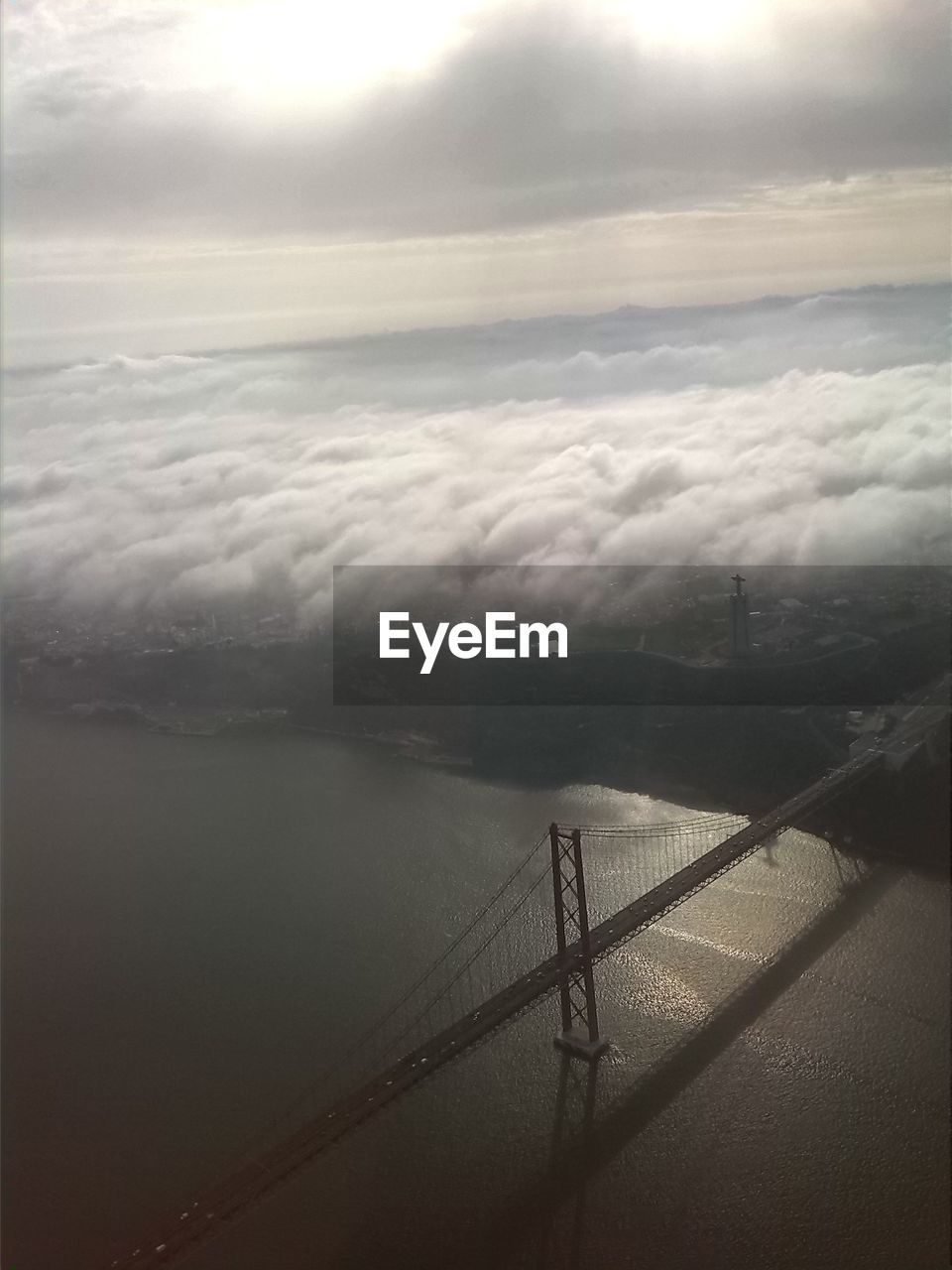 Aerial view of landscape against cloudy sky