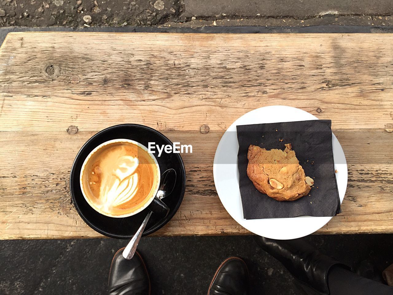 Directly above view of coffee and cookie on table
