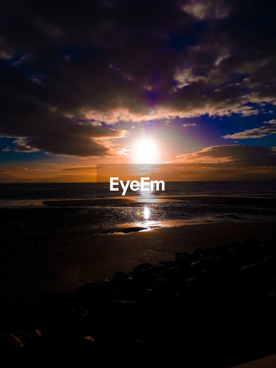 SCENIC VIEW OF SUNSET OVER SEA