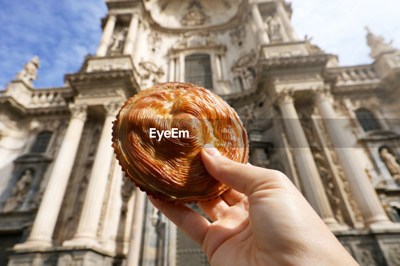 Murcian meatloaf with cathedral of murcia, spain