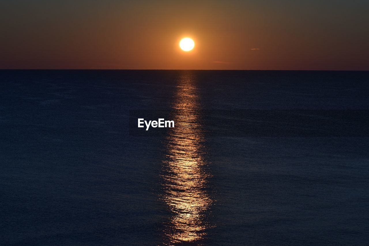 SCENIC VIEW OF SEA DURING SUNSET