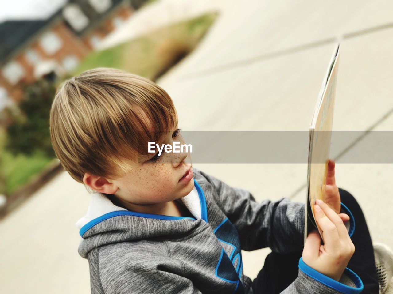 Close-up of boy holding book