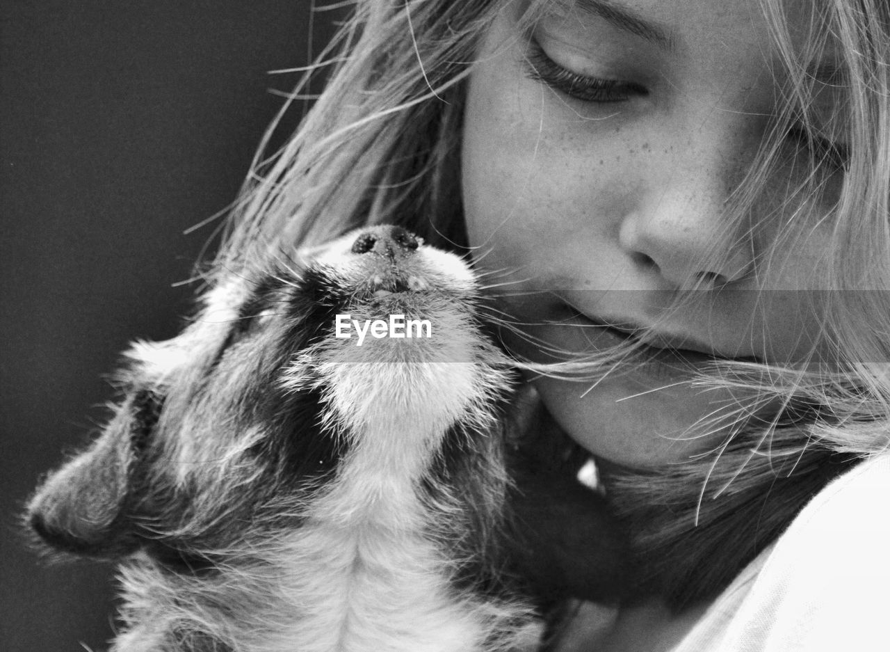 Close-up of girl and cat 