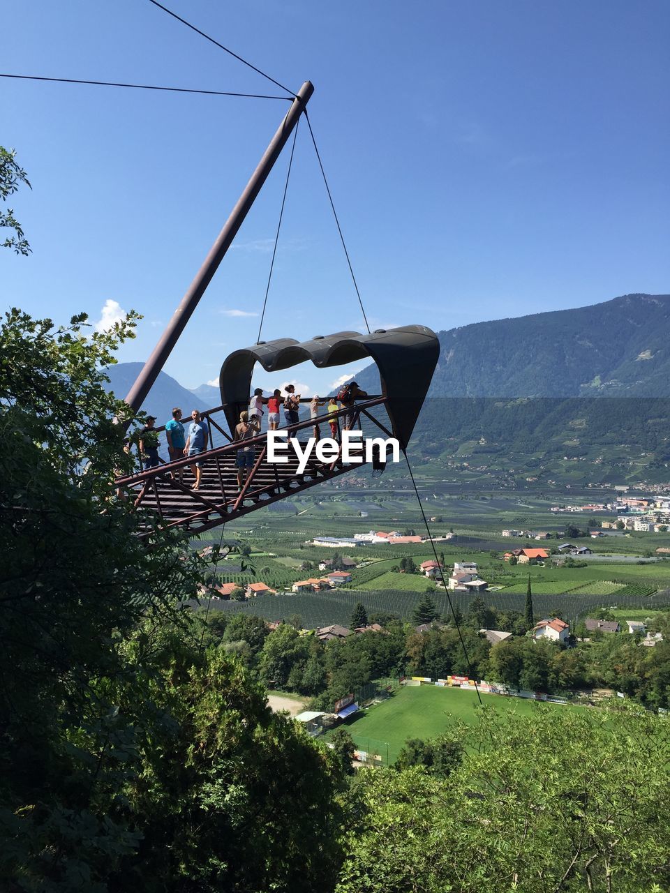 People at observation point at merano against sky