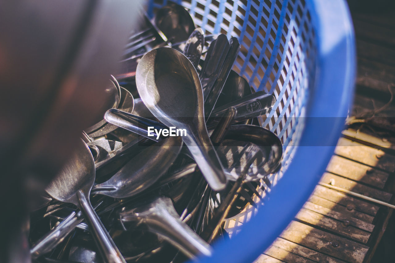 Directly above shot of eating utensils in basket at home