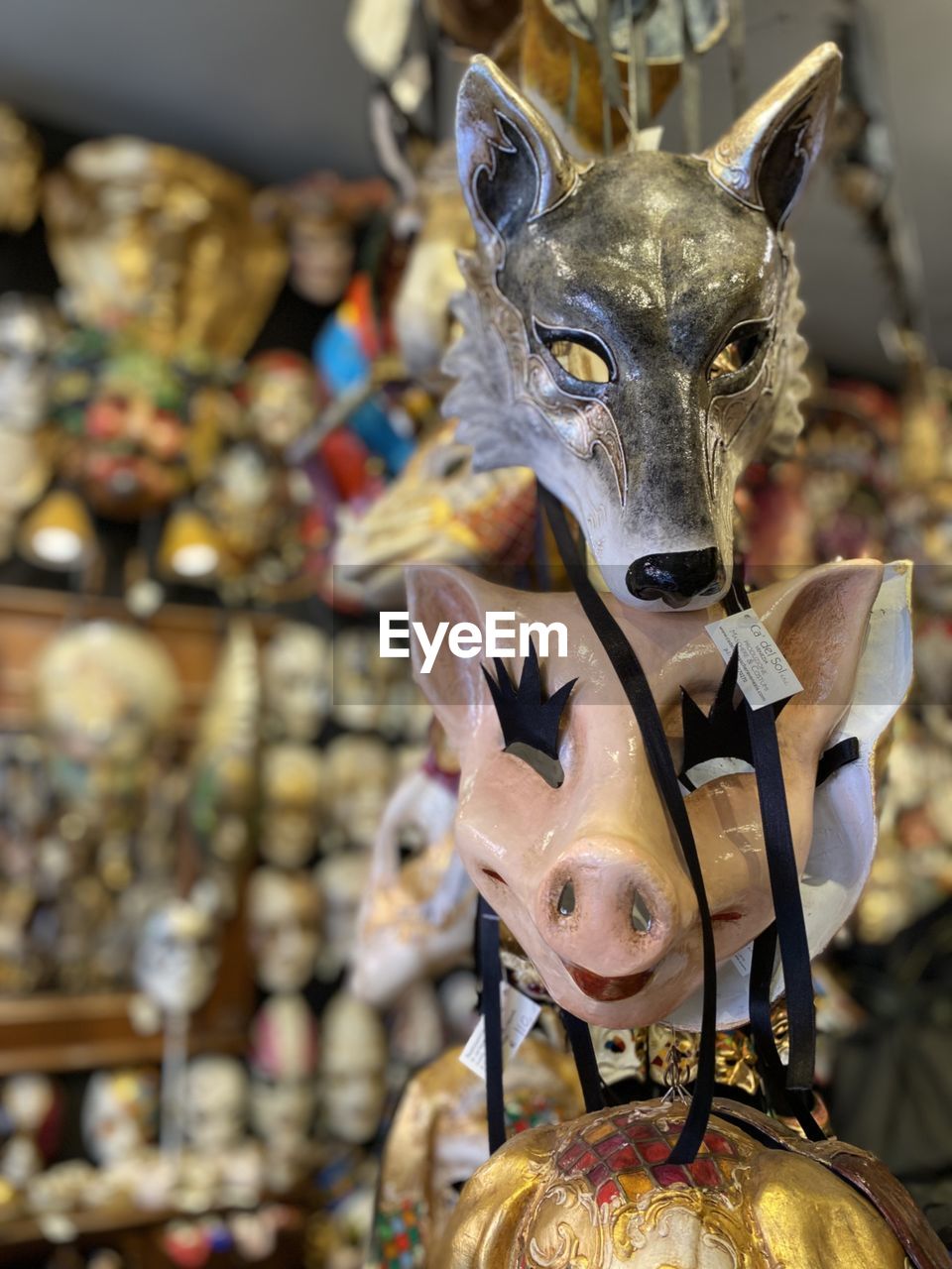 Close-up of  wolf  mask and of pig mask 