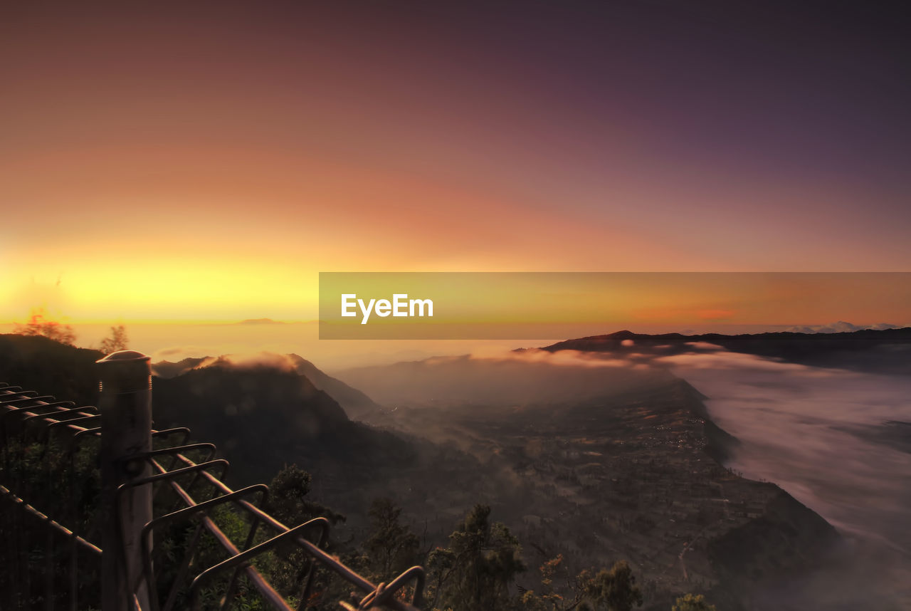 Scenic view of mountains against sky during sunset