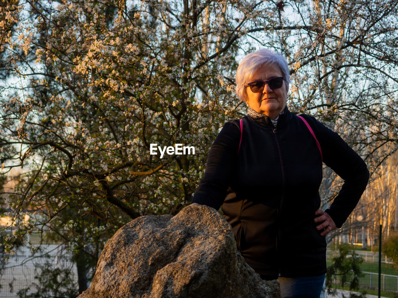 Portrait of senior woman standing in park