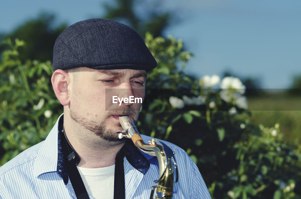 Close-up of man playing saxophone