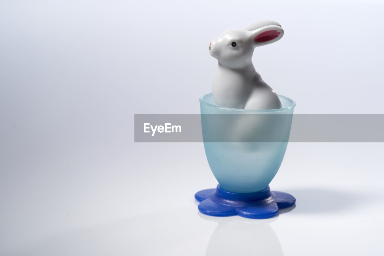 Toy rabbit in a plastic egg cup