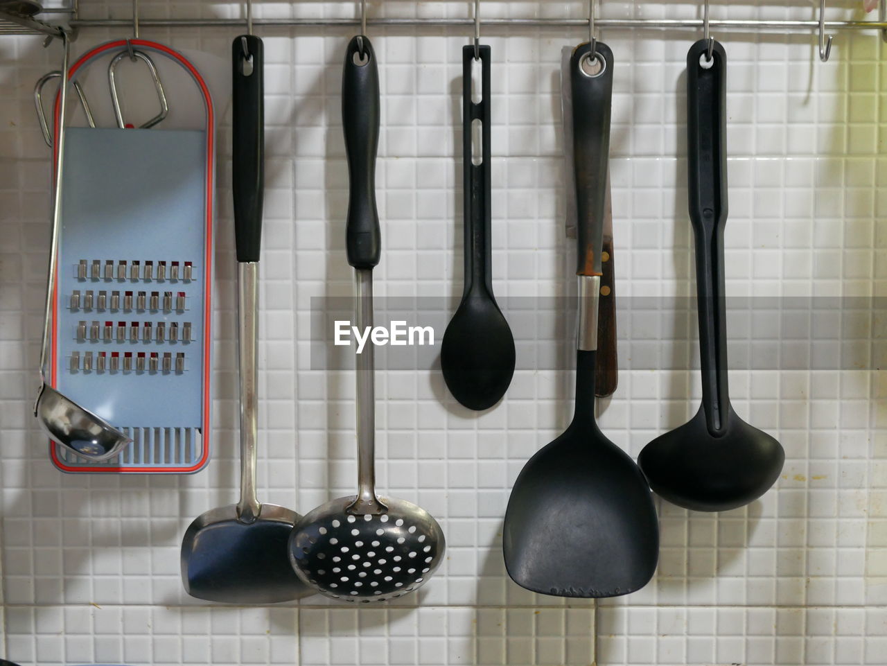 Cookware hanging on floor in kitchen