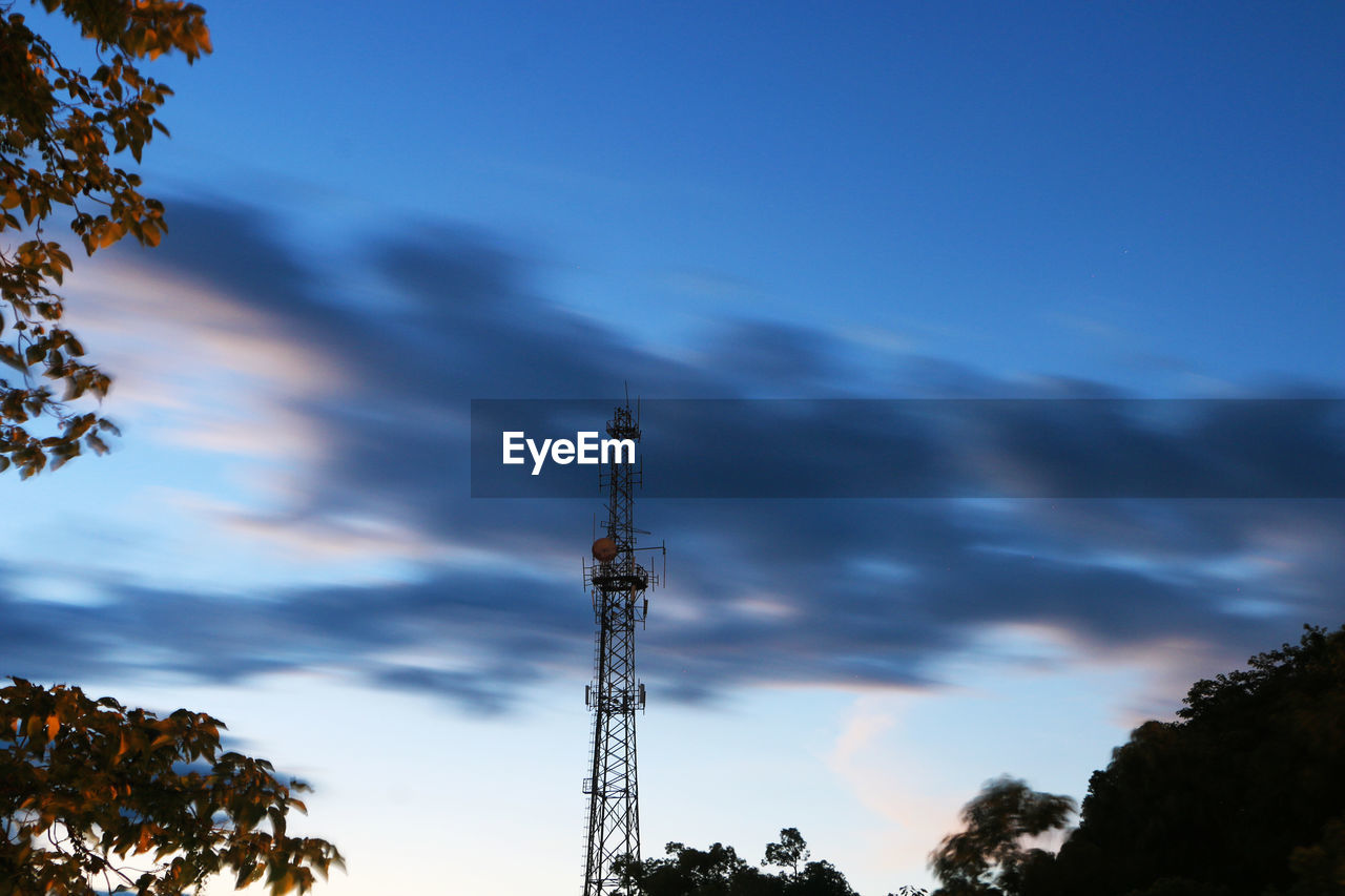 Low angle view of communications tower against sky