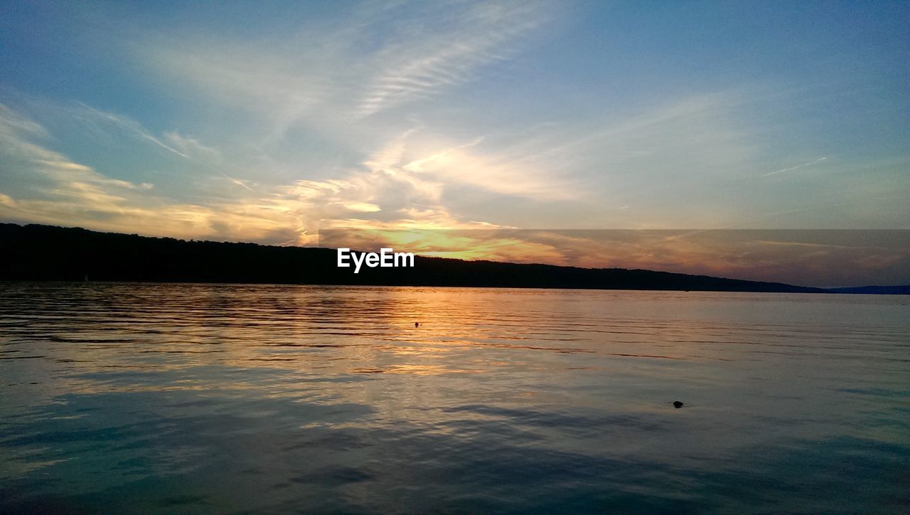 SCENIC VIEW OF LAKE DURING SUNSET