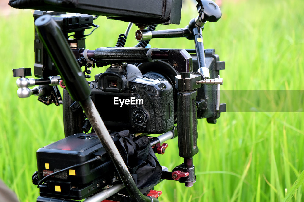 CLOSE-UP OF CAMERA ON FIELD