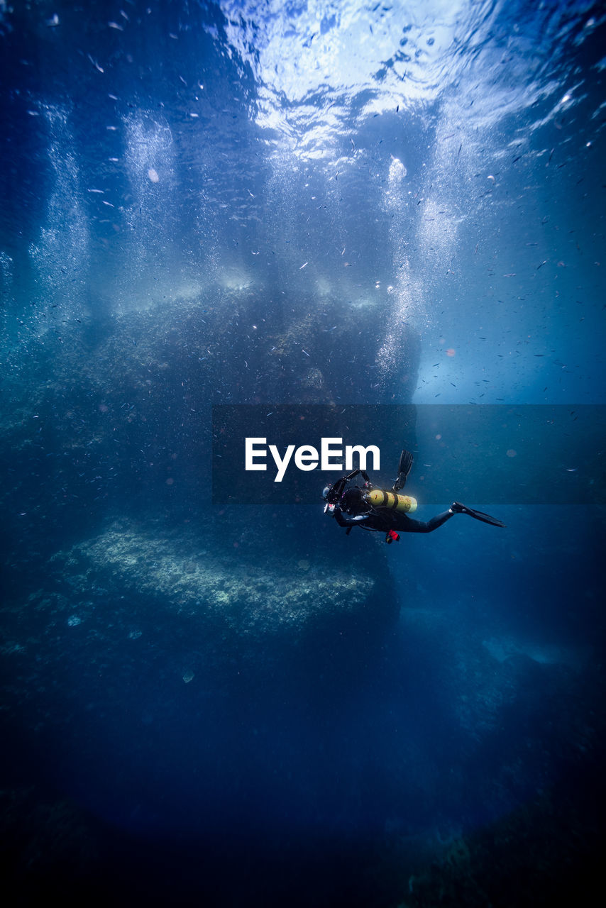 High angle view of man swimming in sea