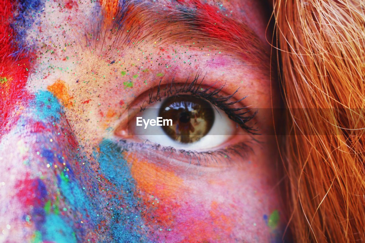 Close-up of young woman with powder paint on face