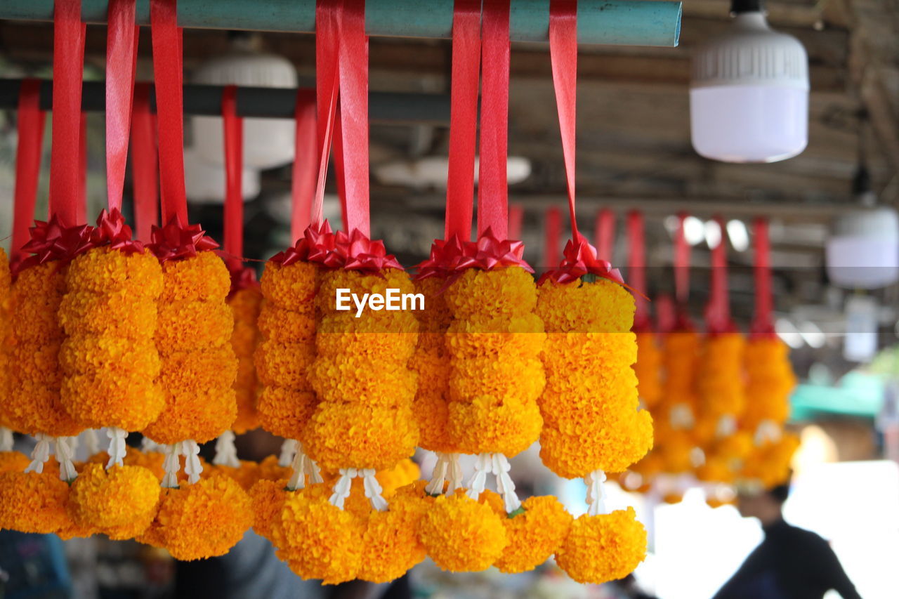 hanging, food and drink, food, market, market stall, retail, no people, flower, freshness, in a row, produce, spice, business, variation, focus on foreground, yellow, business finance and industry, red, large group of objects, asian food, abundance, multi colored, close-up, fast food