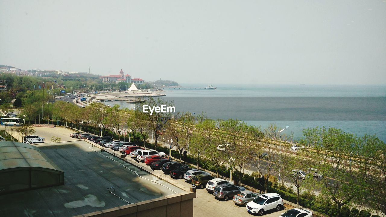 HIGH ANGLE VIEW OF VEHICLES ON BEACH