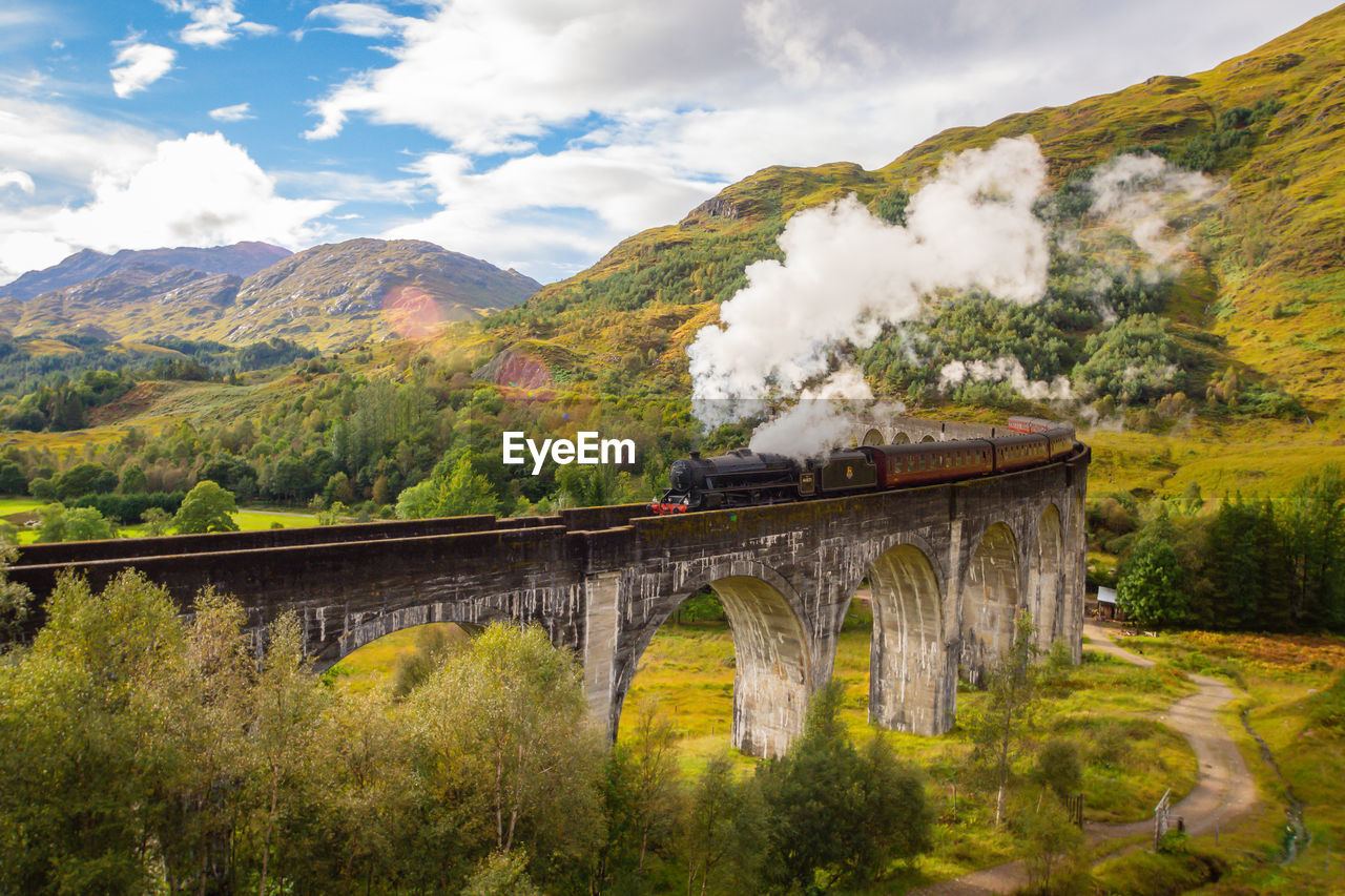 Arch bridge over mountains
