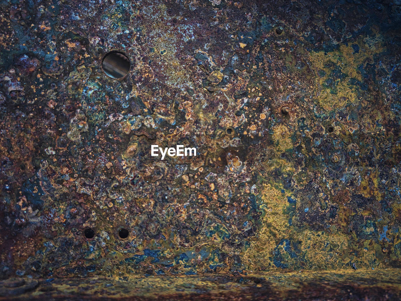 full frame, no people, backgrounds, textured, pattern, day, close-up, rusty, water, outdoors, rock, nature, high angle view, metal, multi colored, weathered