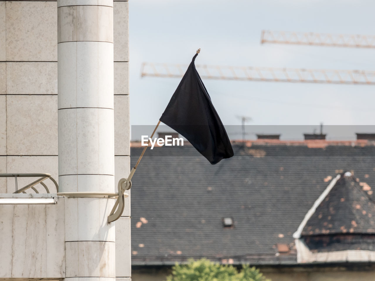 Close-up of black flag on architectural column