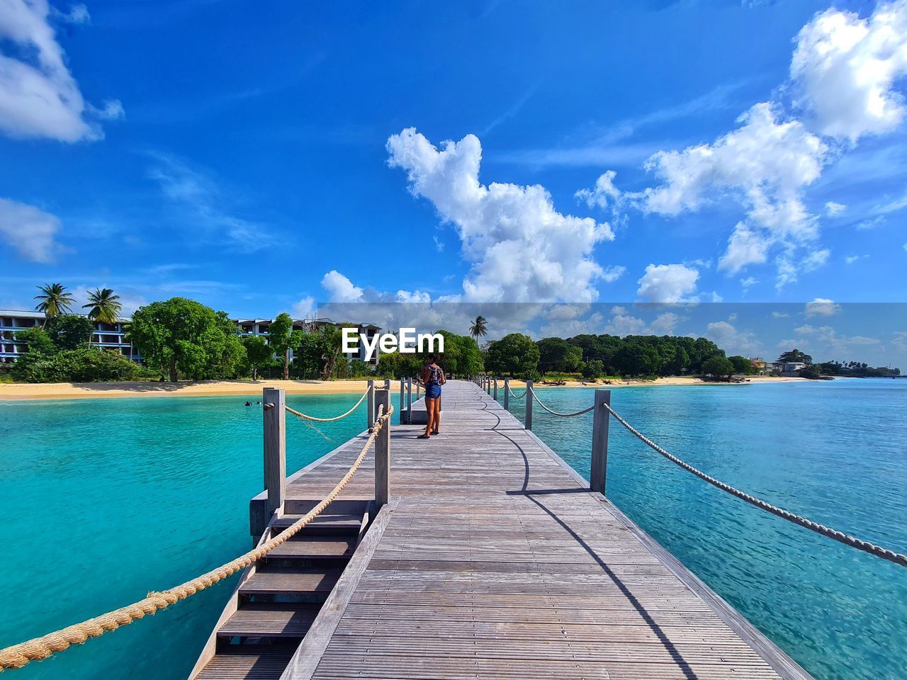 PEOPLE ON SEA AGAINST BLUE SKY