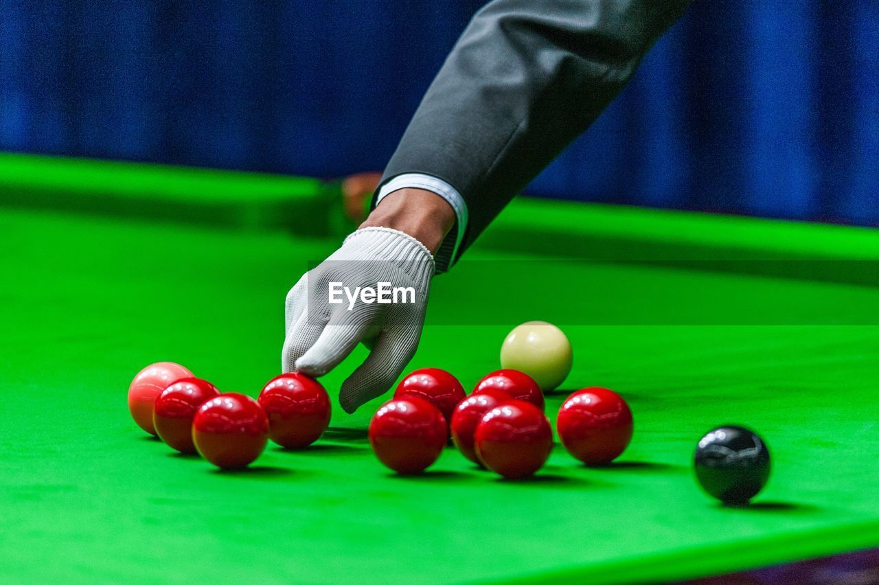 LOW SECTION OF MAN PLAYING WITH BALL