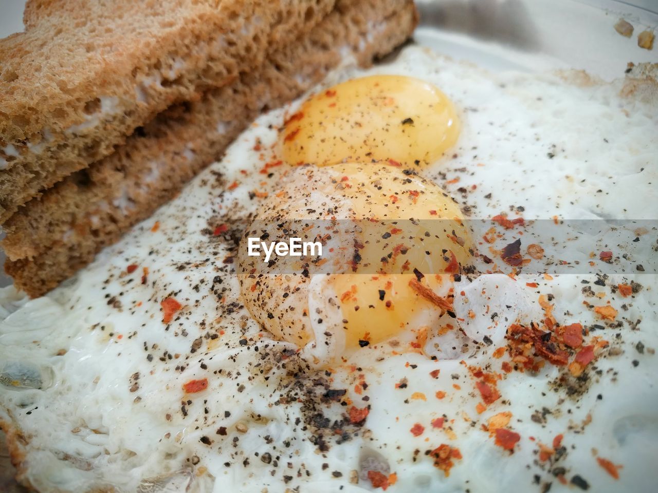 Close-up of brown bread and egg yolk