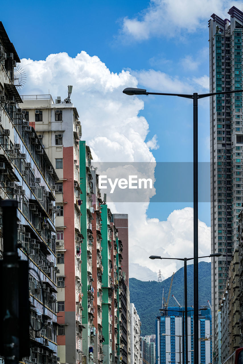 LOW ANGLE VIEW OF MODERN BUILDINGS AGAINST SKY