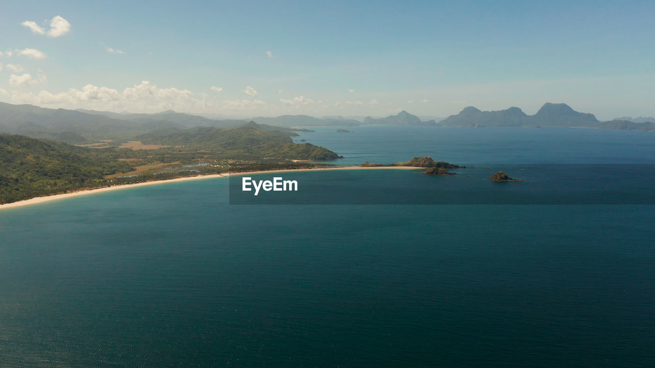 Seascape with tropical islands, mountains and beaches. nacpan, el nido, palawan, philippines. 