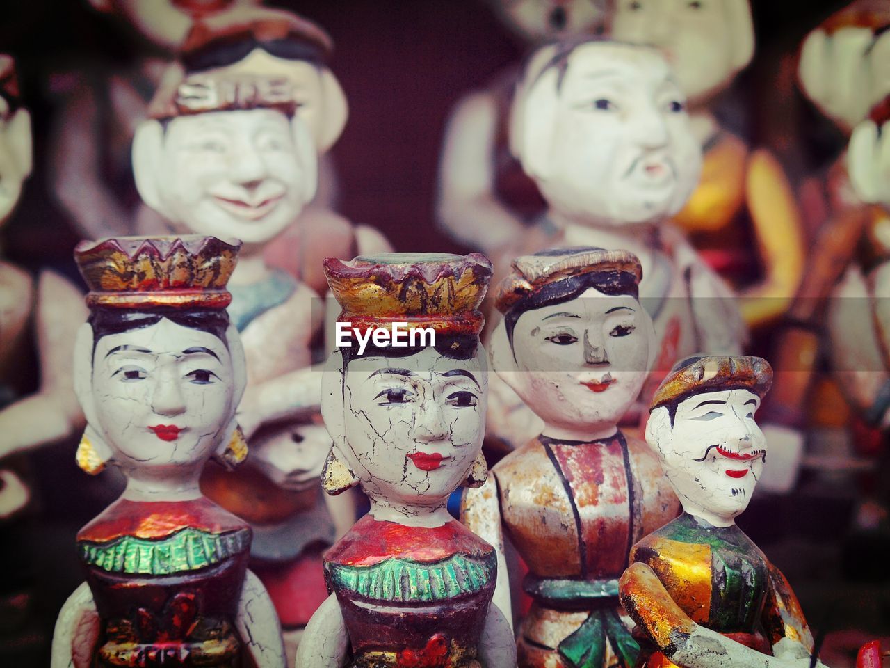 Close-up of antique figurines for sale at market stall