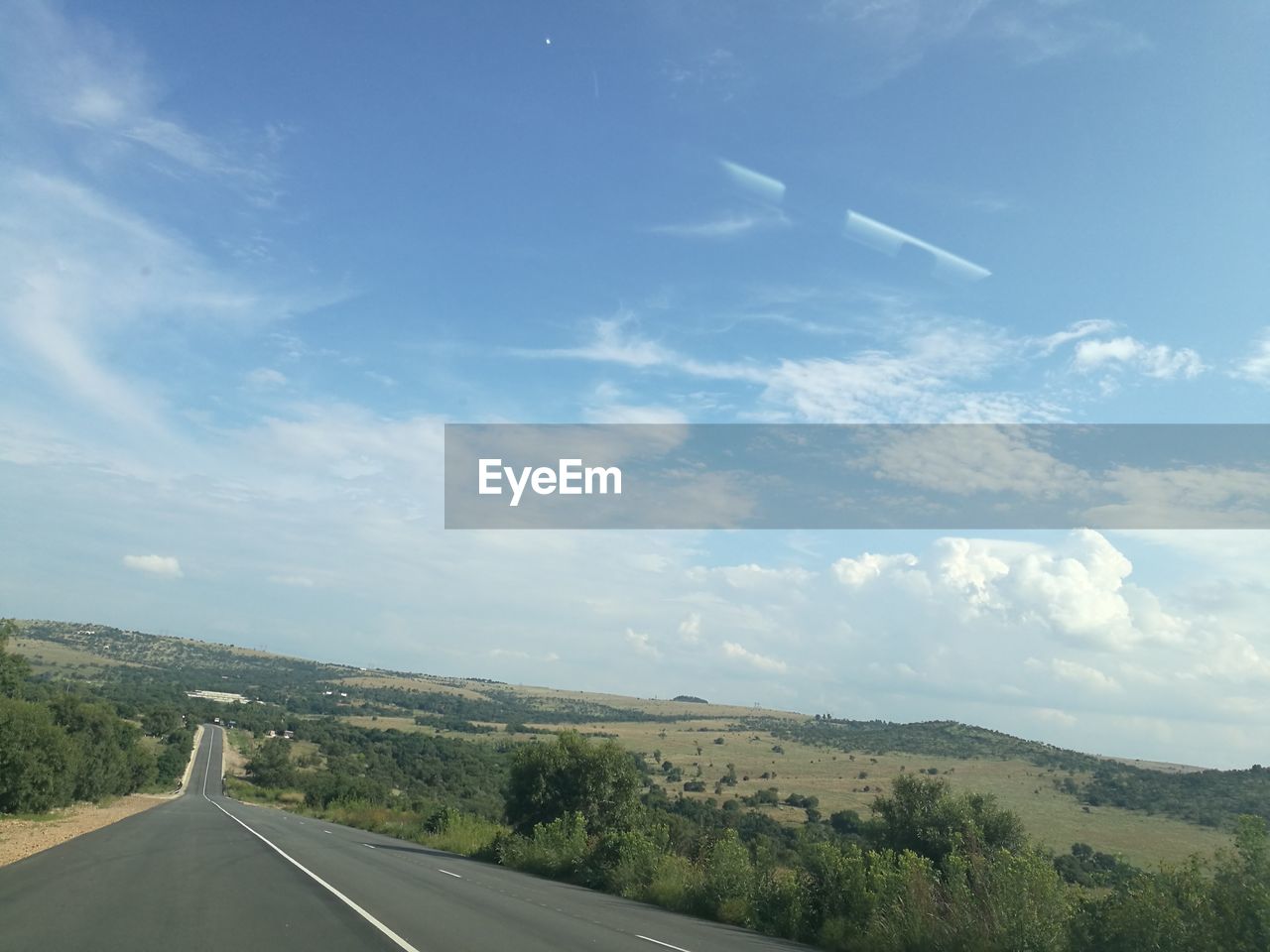 SCENIC VIEW OF ROAD AMIDST LANDSCAPE AGAINST SKY