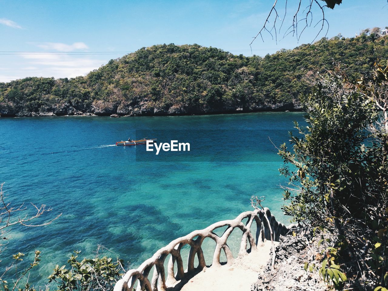 Scenic view of sea against blue sky