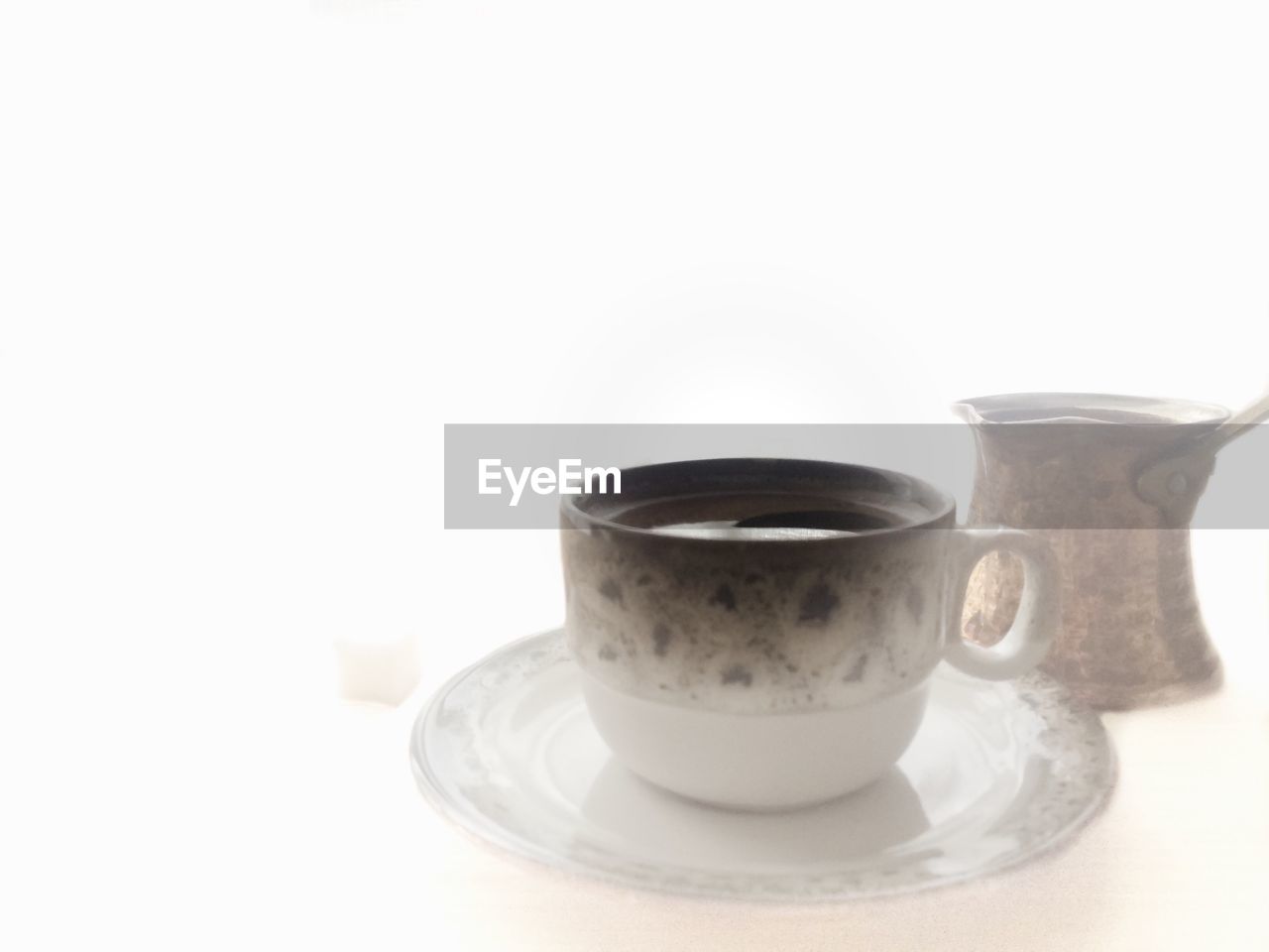 Close-up of turkish coffee on white background
