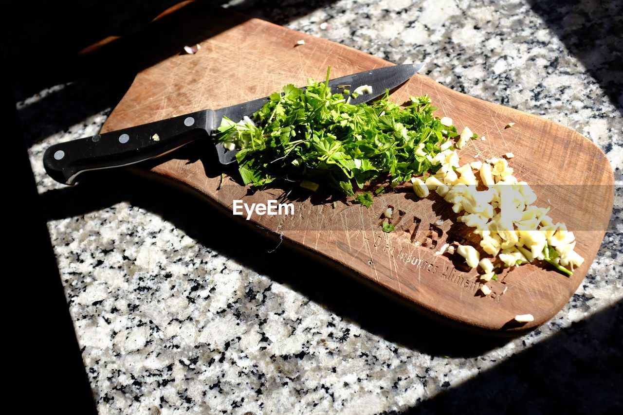 High angle view of chopped vegetables on cutting board