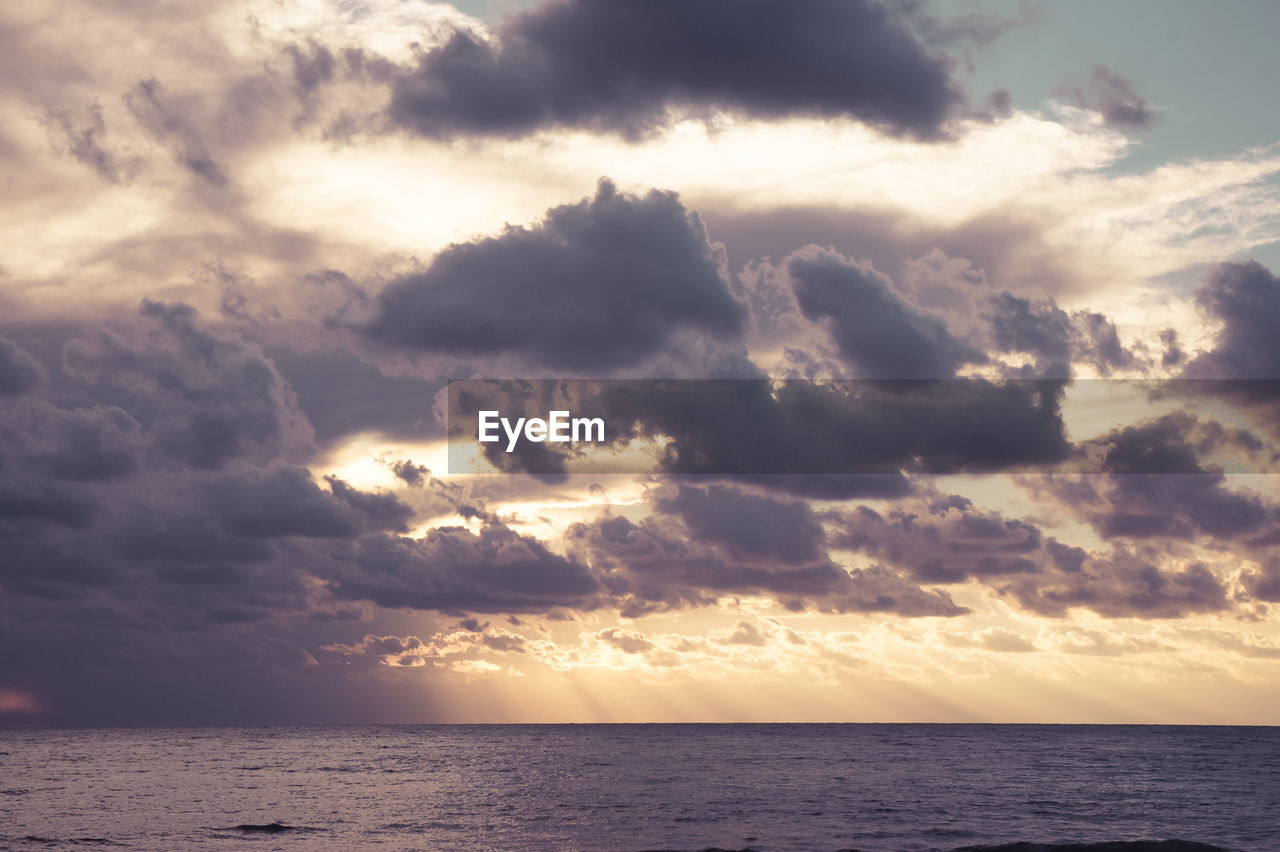 SEA AGAINST SKY DURING SUNSET