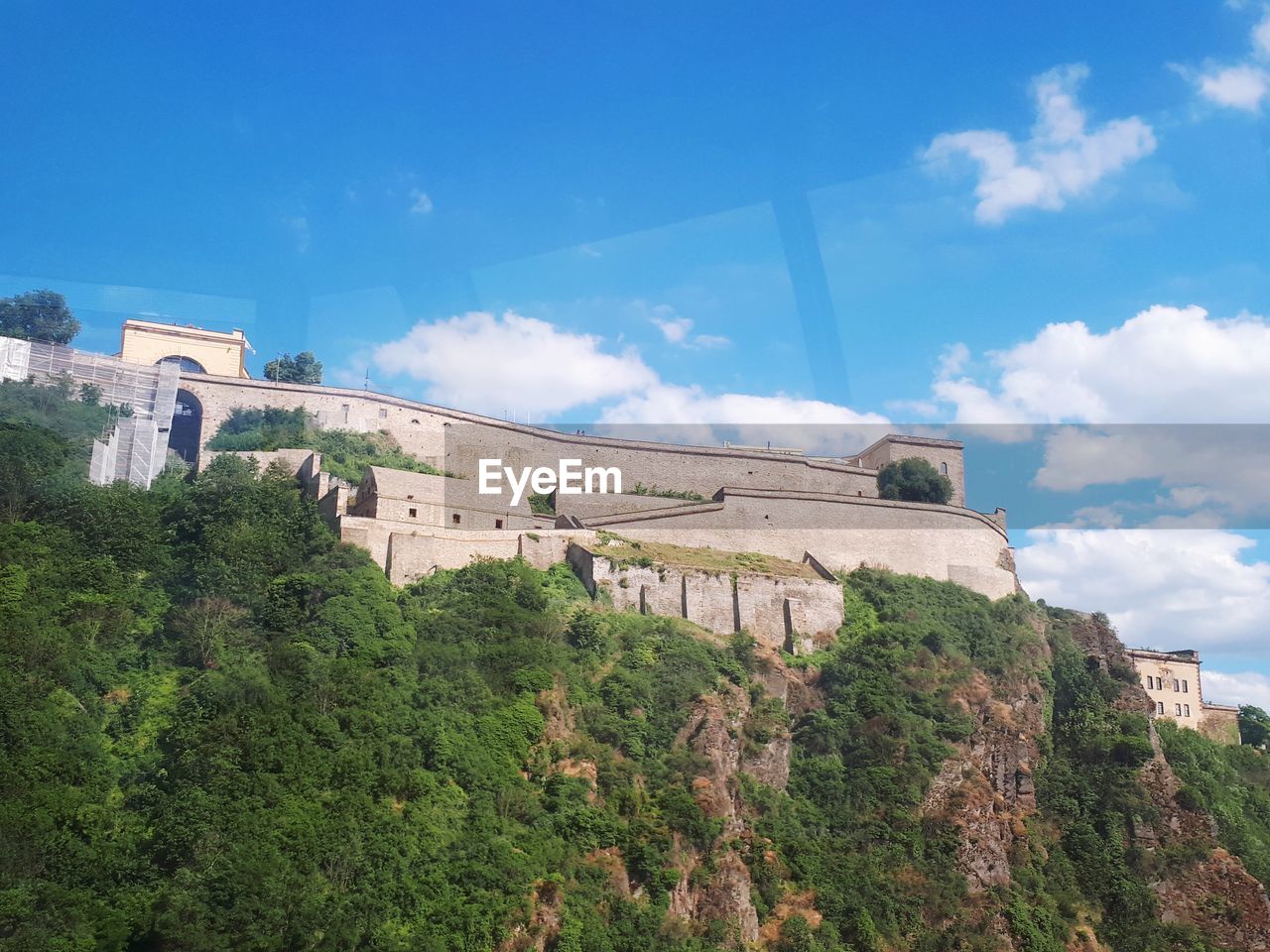 LOW ANGLE VIEW OF FORT AGAINST BLUE SKY