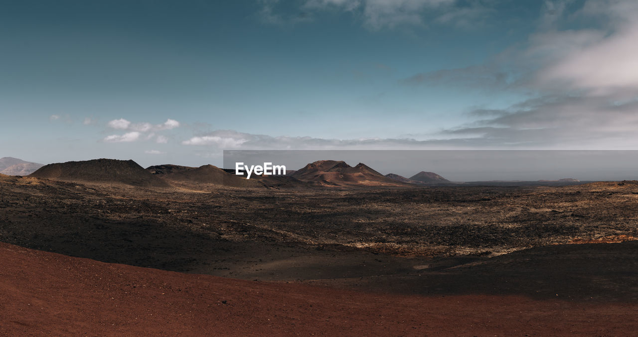 Panoramic view of a volcanic landscape in timanfaya national park, lanzarote