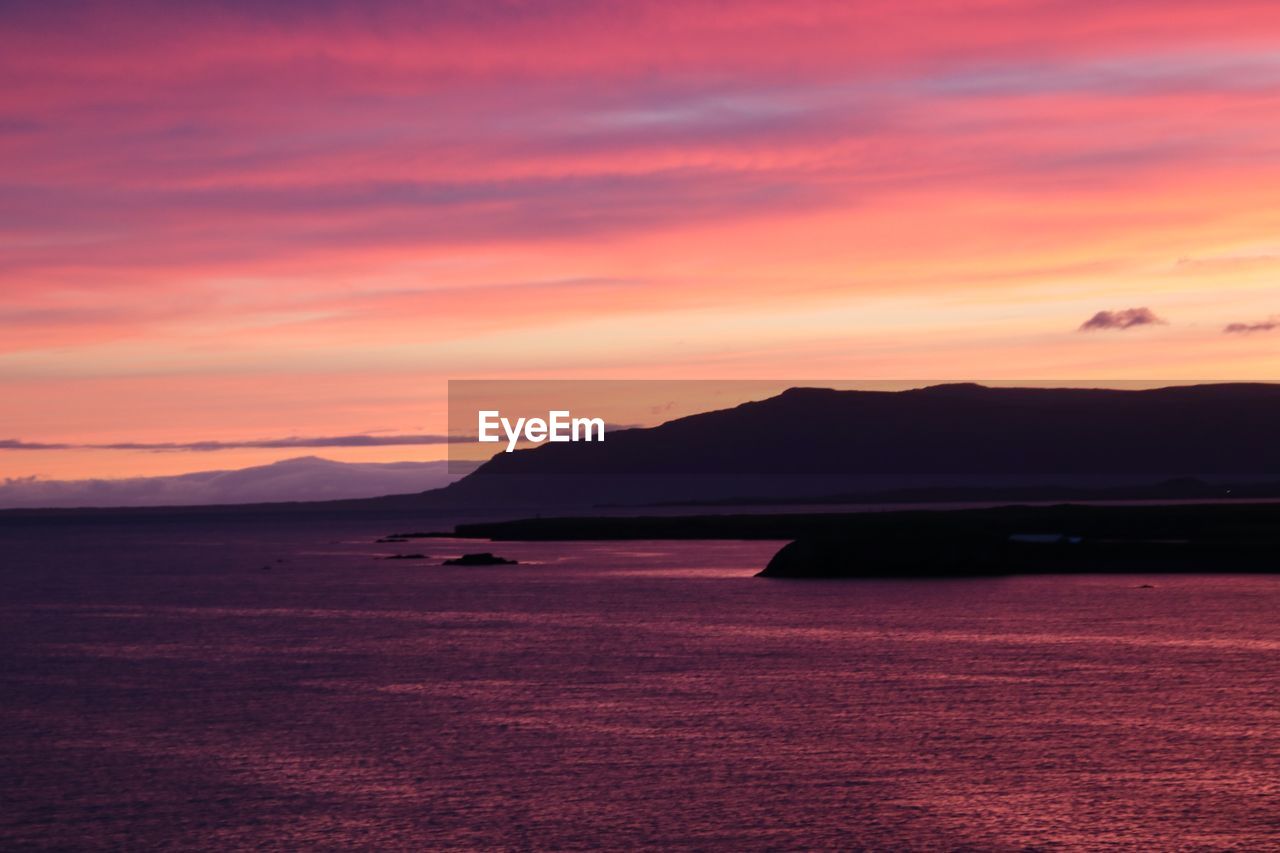 SCENIC VIEW OF SEA AGAINST ROMANTIC SKY