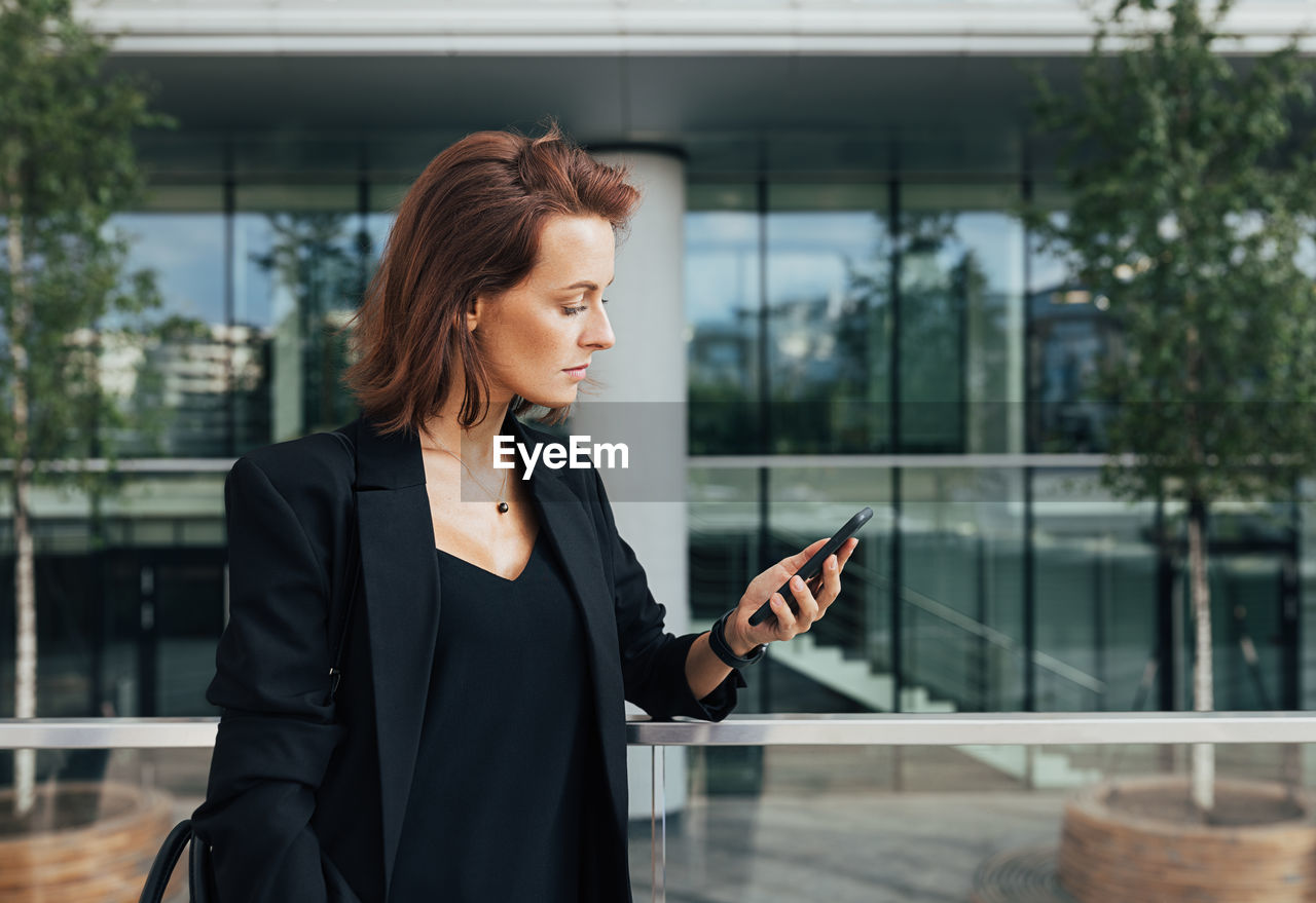 portrait of young woman using mobile phone