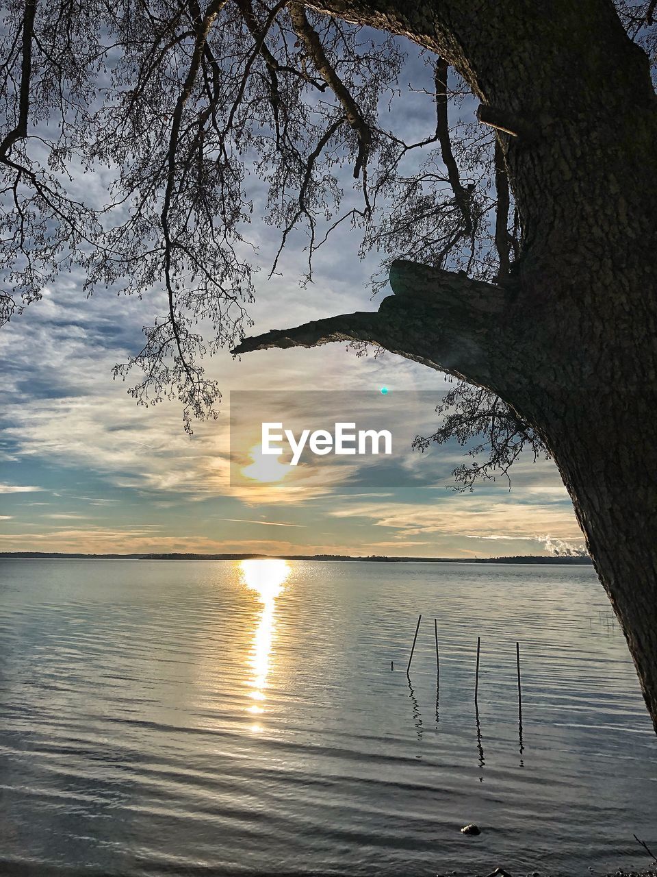 SCENIC VIEW OF LAKE AT SUNSET