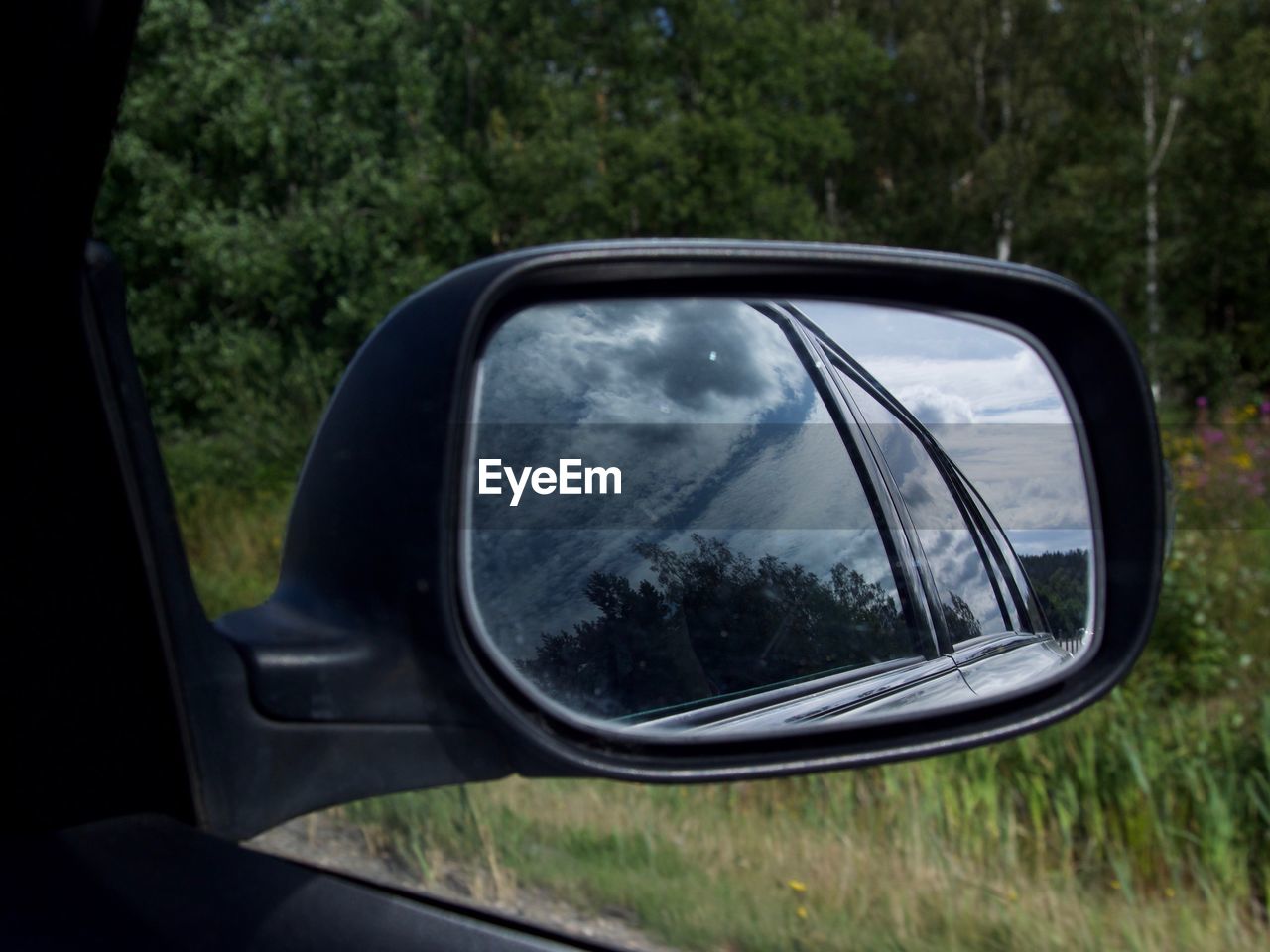 REFLECTION OF SIDE-VIEW MIRROR OF CAR